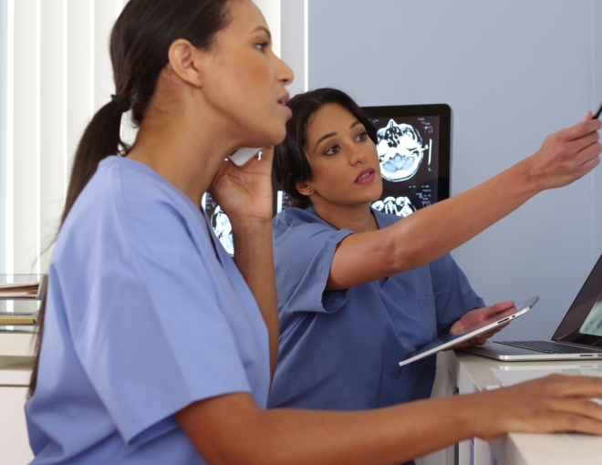 two nurses discuss patient scans