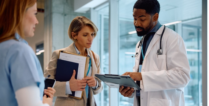 Doctors looking at charts having a conversation