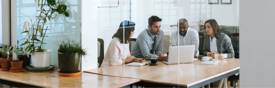 employees conversing in conference room